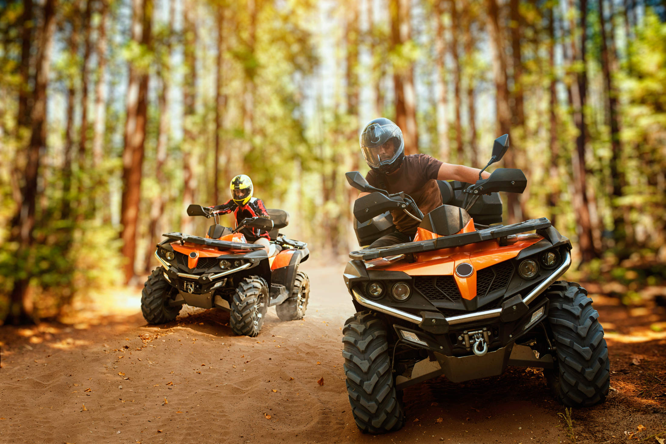 Two,Atv,Riders,,Speed,Race,In,Forest,,Front,View